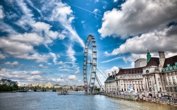 A bright day shows the London Eye and detailed riverside buildings by the River Thames, 2K Desktop Wallpaper