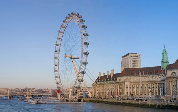 The London Eye overlooks the River Thames with surrounding historic buildings, 2K Desktop Wallpaper