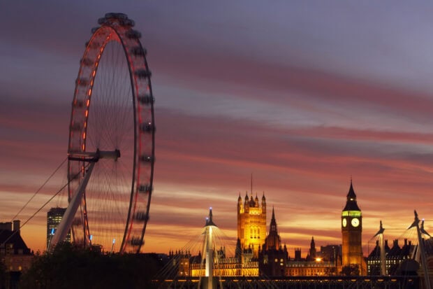 The London Eye stands tall during a vibrant sunset with historic buildings nearby in London Eye Wallpapers, HD Desktop Wallpaper