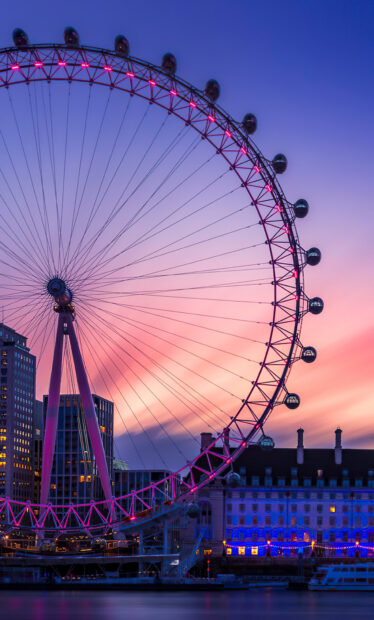 The London Eye is beautifully lit at sunset with city buildings in the background, HD Mobile Wallpaper