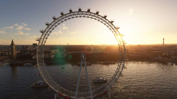 The London Eye stands tall over the river Thames with the sunset casting warm light across the cityscape, 2K Wallpaper