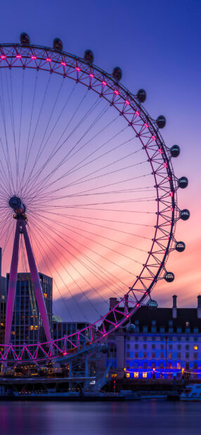 London Eye illuminated against a colorful sunset sky in the city, 2K Mobile Wallpaper