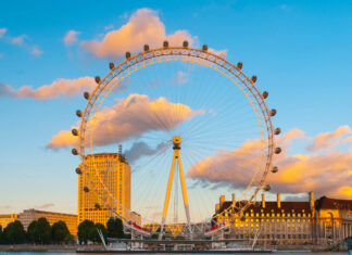 The London Eye stands tall by the river with a vibrant sunset sky and clouds, HD Desktop Wallpaper