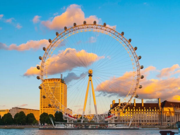The London Eye stands tall by the river with a vibrant sunset sky and clouds, HD Desktop Wallpaper