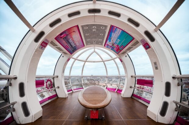 The London Eye pod offers panoramic views of the cityscape with a comfortable seating area, 2K PC Wallpaper