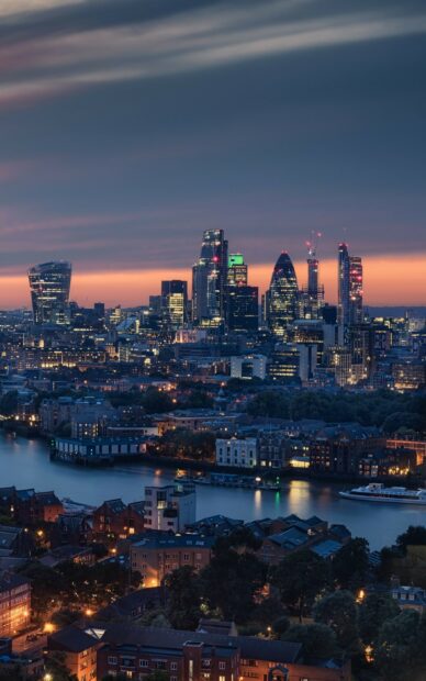 The United Kingdom Wallpapers capture the vibrant city skyline of London illuminated at dusk, 2K Phone Wallpaper