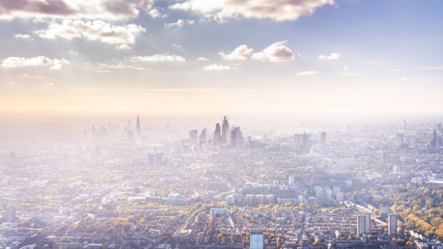 A wide view of London skyline shows skyscrapers and cityscape under a partly cloudy sky, 4K Desktop Wallpaper
