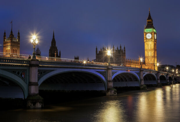 The illuminated Big Ben clock tower stands over the Thames river at night in the United Kingdom wallpapers, HD Desktop Wallpaper