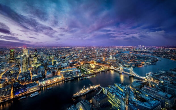 The London skyline glows with city lights along the River Thames in the United Kingdom Wallpapers, 2K Desktop Wallpaper