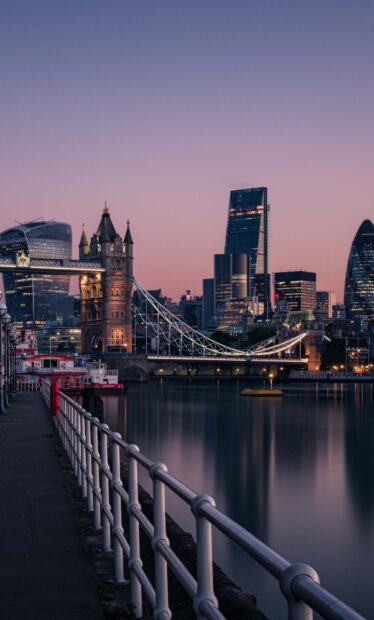 The London skyline shows the Tower Bridge and modern skyscrapers during sunset, HD Mobile Wallpaper