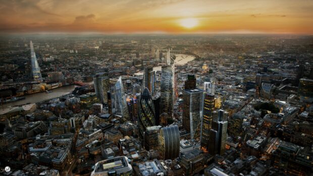 The London skyline shows iconic skyscrapers and the River Thames during sunset, 4K Desktop Wallpaper