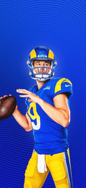 A Los Angeles Rams player prepares to throw the football during a game, HD Phone Wallpaper