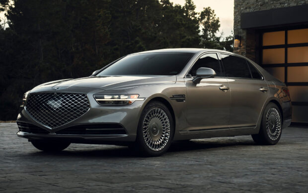 A sleek Genesis car is parked in front of a contemporary home surrounded by trees during dusk, HD Desktop Wallpaper