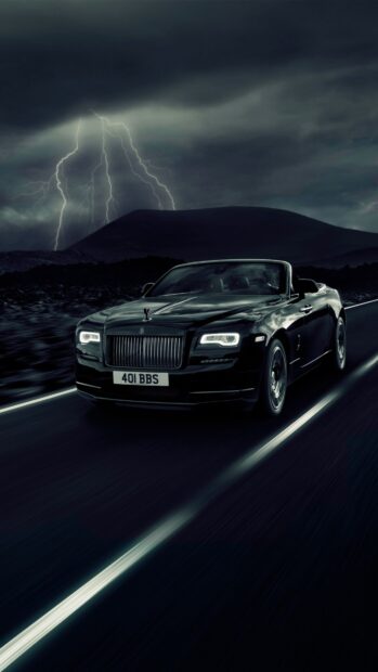 A black Rolls Royce Dawn drives on a dark road under stormy skies with lightning, 4K Phone Wallpaper