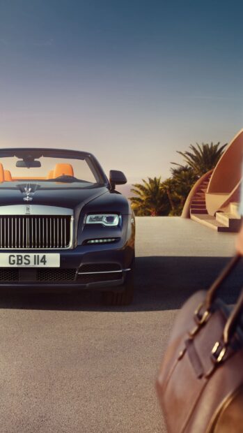 A Rolls Royce Dawn convertible is parked near a modern staircase and palm trees at sunset, 2K Phone Wallpaper