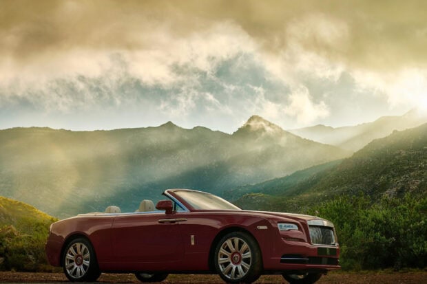 A luxury Rolls Royce Dawn convertible car parked with misty mountains in the background, HD Desktop Wallpaper
