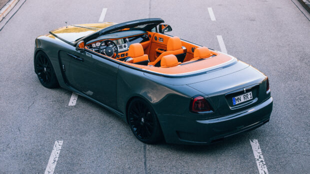 A dark green Rolls Royce Dawn convertible is shown with orange seats on an empty road, 4K Desktop Wallpaper