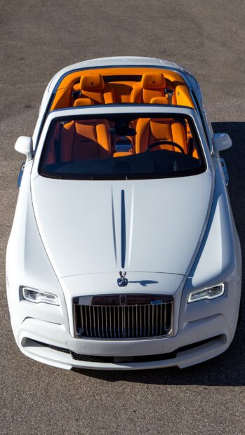 A white Rolls Royce Dawn car features a vivid orange interior, 2K Phone Wallpaper