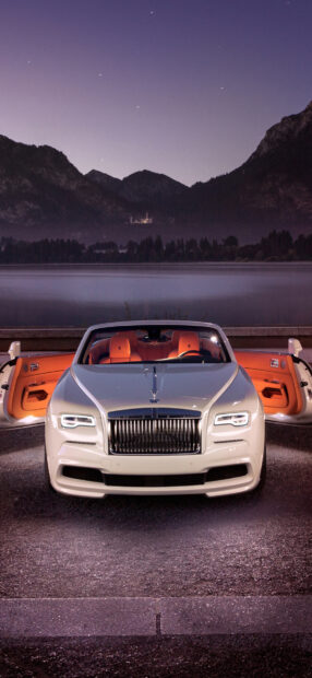 A Rolls Royce Dawn is parked with both doors open against a mountain lake at twilight, HD Phone Wallpaper