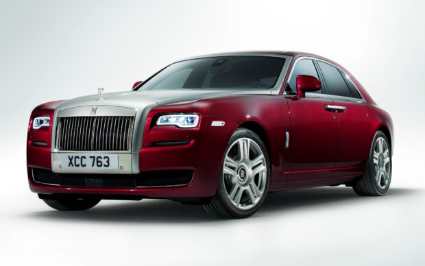 A Rolls Royce Ghost with a sleek design and bright headlights on a plain background, HD Desktop Wallpaper