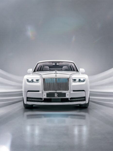 Luxury Rolls Royce Phantom is displayed in a sleek modern studio setting, HD Mobile Wallpaper