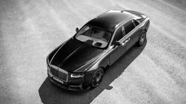 A sleek black Rolls Royce Ghost car parked on the pavement under sunlight, HD Desktop Wallpaper
