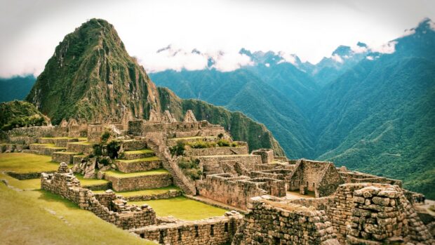 Ancient Machu Picchu site nestled among lush green mountains
