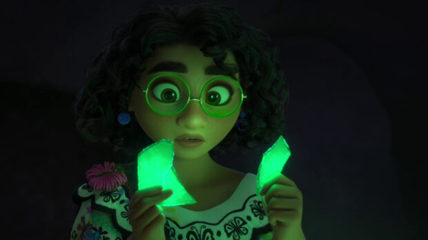 A girl with curly hair holds glowing green shards from Encanto, HD Desktop Wallpaper