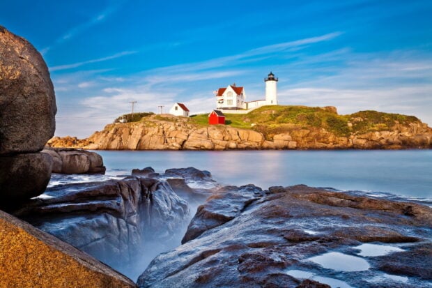 A lighthouse stands on rocky coast with blue sky in Maine Wallpapers, HD Desktop Wallpaper