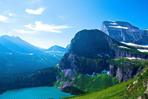 The Montana Wallpapers show green hills and a turquoise lake under a clear blue sky, HD Desktop Wallpaper