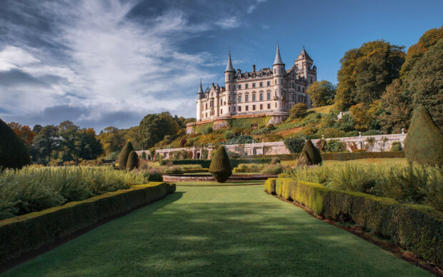 A majestic castle is surrounded by lush gardens under a blue sky in the United Kingdom Wallpapers, HD Desktop Wallpaper