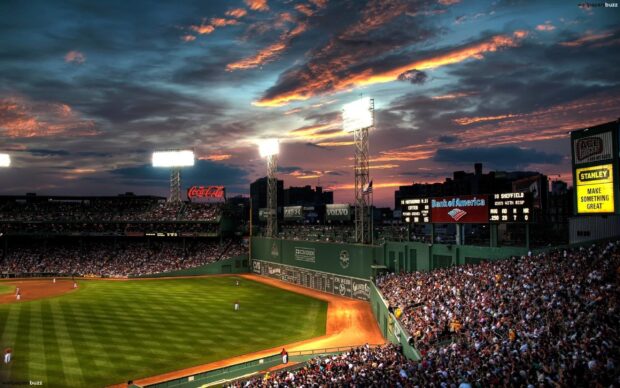 The crowd and players are visible during a Major League Baseball game at sunset, 2K Desktop Wallpaper