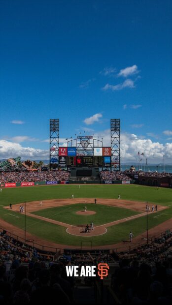 A Major League Baseball game in progress under clear skies in a large stadium, HD Mobile Wallpaper