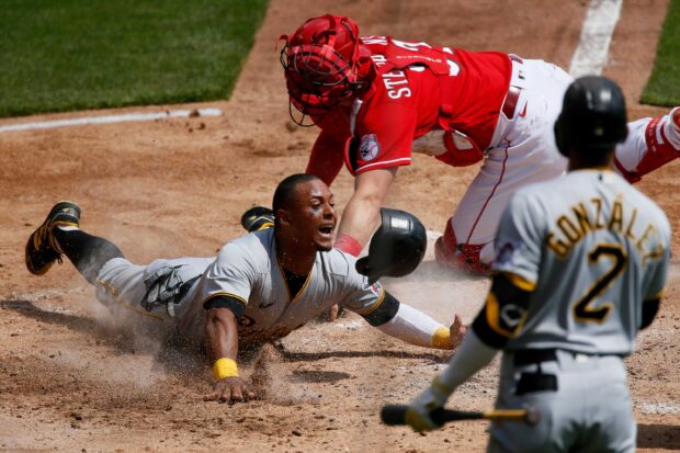 A baseball player slides into home plate while a catcher tries to tag him in a Major League Baseball game, 2K Desktop Wallpaper