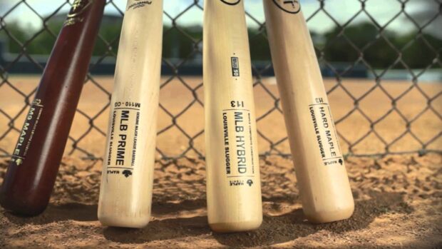 Four baseball bats standing on the dirt field with a fence background in a Major League Baseball setting, HD Desktop Wallpaper