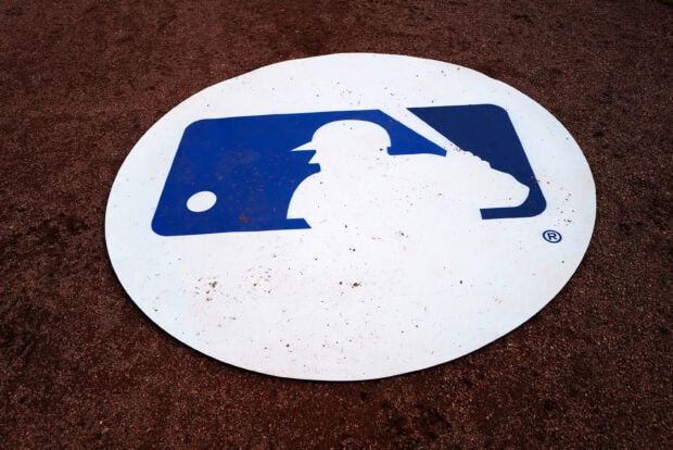 The Major League Baseball logo is displayed on a baseball field covered with dirt, 2K Desktop Wallpaper