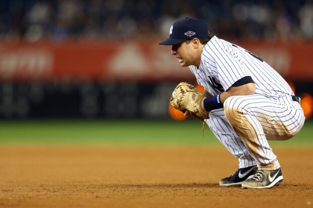 A Major League Baseball player in striped uniform crouches on the field during a game, 2K Desktop Wallpaper