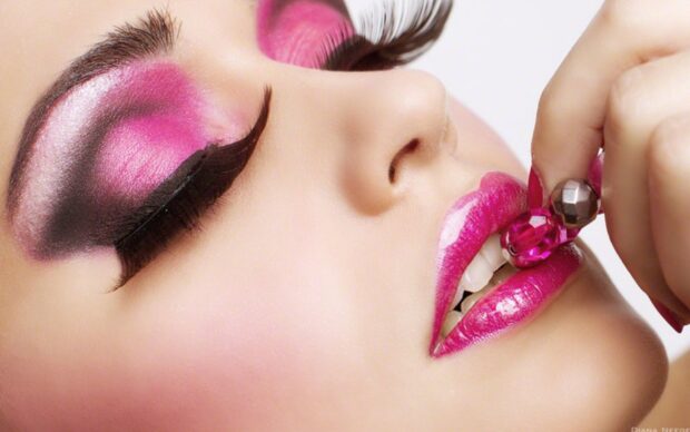 Close up of makeup on eyelids and lips showing creative makeup