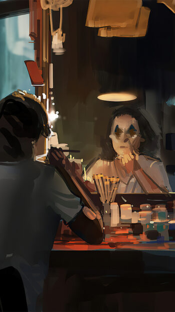 Woman applying makeup in front of mirror using makeup tools in a dimly lit room