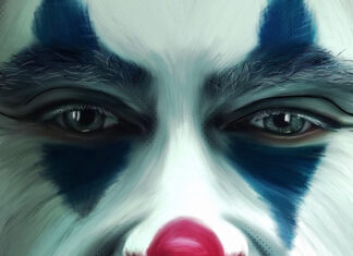 Close up of clown makeup with red nose and blue eye details on face