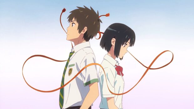 Two high school students connected by a red string stand back to back in a Makoto Shinkai scene