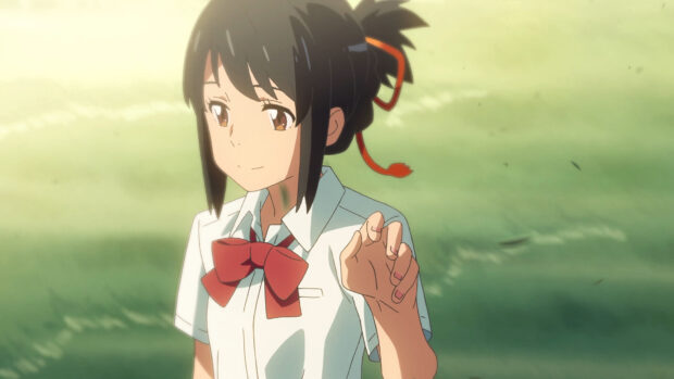 A Makoto Shinkai anime character with a red bow tie smiling gently in a serene outdoor setting