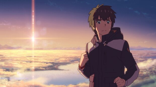 A Makoto Shinkai character standing against a glowing sky and cloudscape at sunset