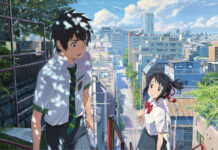 A high school boy and girl walking outside in a city scene from Makoto Shinkai