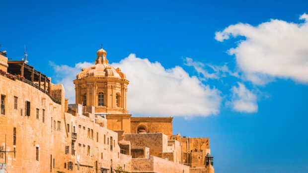 Historic Malta architecture under a clear blue sky with beautiful clouds in 4K quality