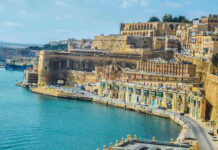 Historic architecture and coastline of Malta with ancient stone buildings along the sea