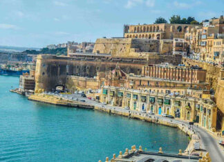 Historic architecture and coastline of Malta with ancient stone buildings along the sea