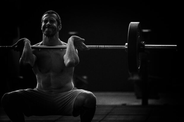 A man is doing a squat with a barbell during his Crossfit workout session, HD Desktop Wallpaper