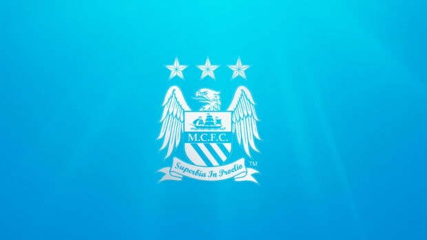 The Manchester City Fc emblem is displayed on a bright blue background, HD Desktop Wallpaper