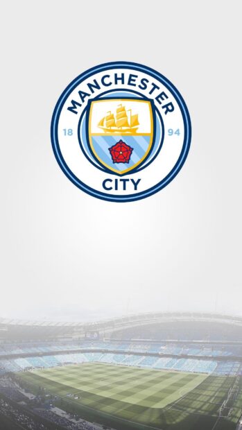 The Manchester City Fc logo is displayed above a large soccer stadium filled with seats, HD Mobile Wallpaper
